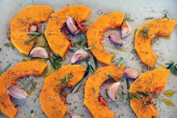 Baked pumpkin with herbs and extra virgin olive oil