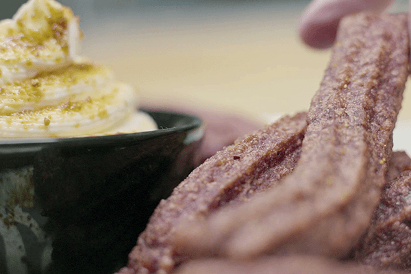 Detail of churros with cream cheese