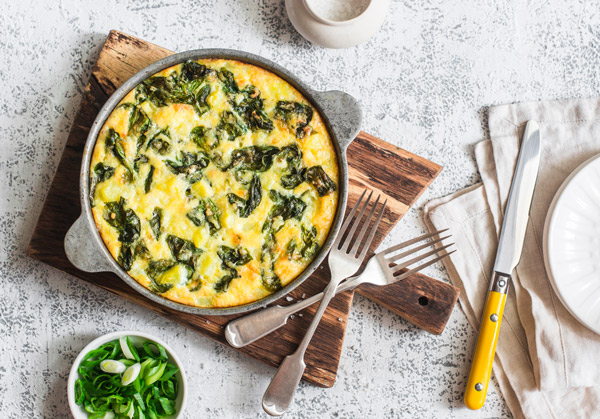 Freshly cooked Spanish tortilla with potatoes and spinach