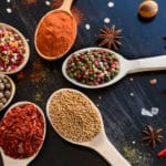 Spices and herbs on old kitchen table. Food and cuisine ingredients