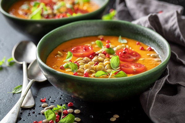 Healthy lentil soup made of legume vegetables and peppers
